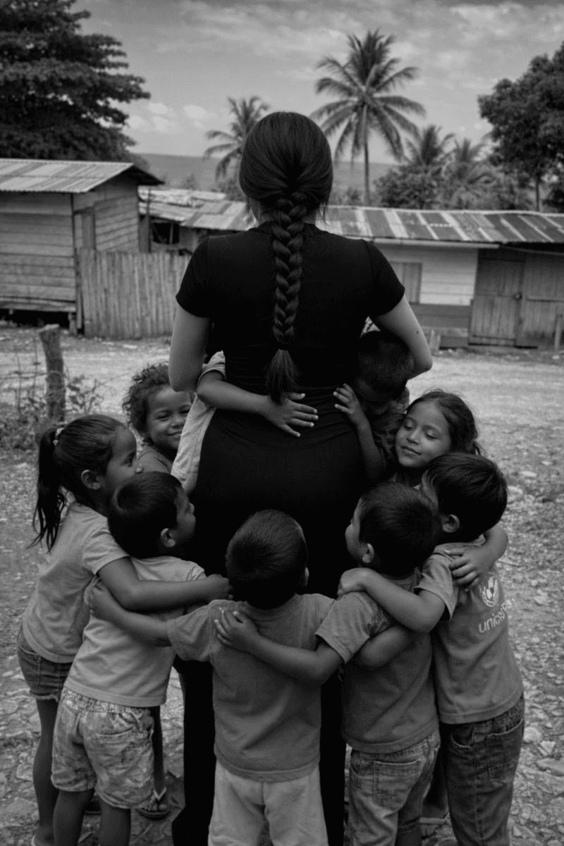 A community gathered in a circle of hands
